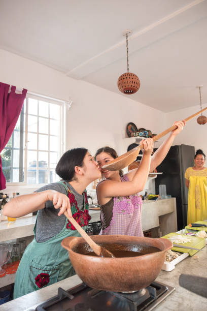 istock Teenaged Girls Being Funny While Making Mole, Mexican Cooking Class 2105344209