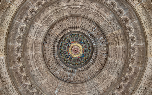 London, UK - Feb 27, 2024 - Elaborate ceiling design of intricately carved stone interior of The Shree Sanatan Hindu Mandir Hindu Temple. Look up, Space for text, Selective focus.
