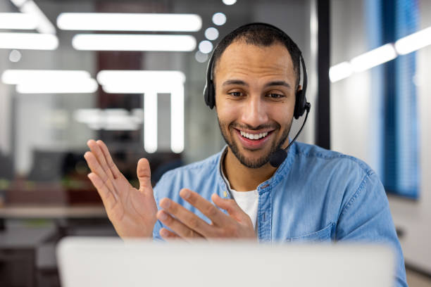 istock Smiling customer service agent with headset in office 2105389592