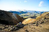 An elevated view from high up showing the wide expanse of the arid inner region of Iceland's Southern coast on the Laugevegur trail