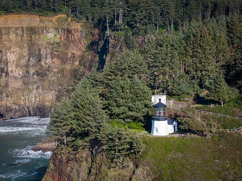Cliffs of Cape Meares Lighthouse on the rugged Oregon Coast. Tillamook County. Drone View.