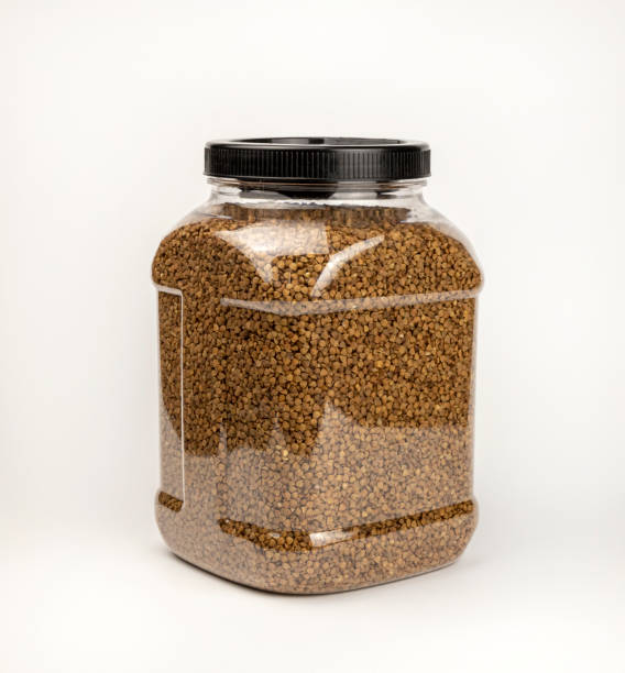 istock Buckwheat groats, in a cereal storage container. Plastic container with buckwheat. 2105487705