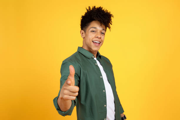 istock Funny stylish african american man pointing finger at camera 2105491471