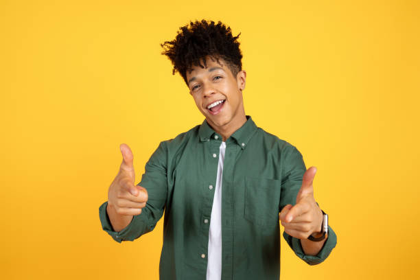 istock Cool African American Guy Pointing At Camera With Two Hands 2105491474