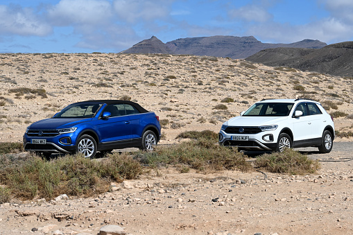 Pájara, Fuerteventura, Spain, February 23, 2024 - A white Volkswagen T-Roc and a blue T-Roc Cabriolet
