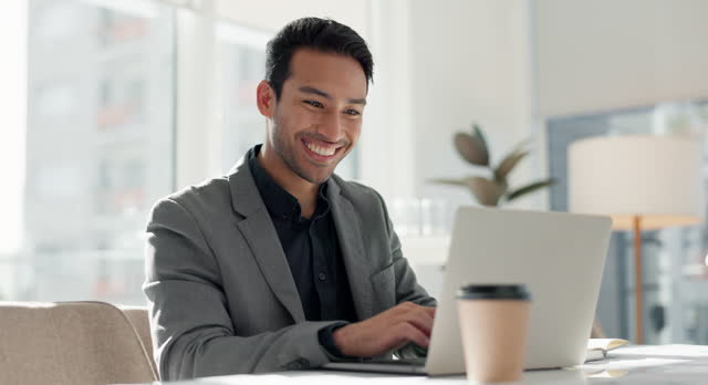 Businessman in office with laptop, market research and notes for social media review, business feedback or planning. Thinking, search and happy man networking online for startup, website and report.