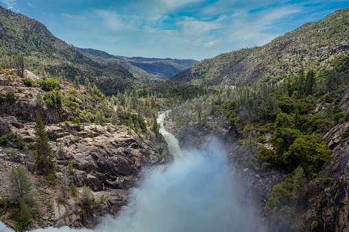 The Tuolumne River as it flows downstream as viewed from the O'Shaughnessy Dam at the Hetch Hetchy Reservoir in Yosemite NP. The high snowmelt in 2023 resulted in a very explosive discharge.