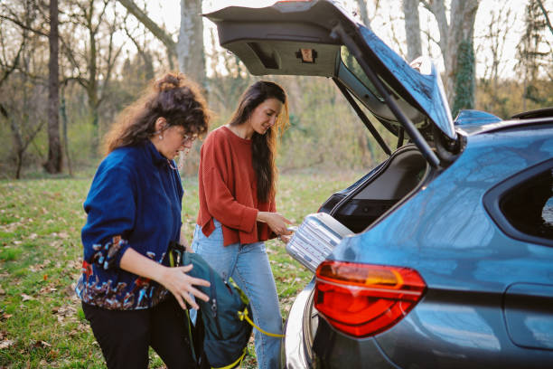 istock female friends packing for a roadtrip 2105551299