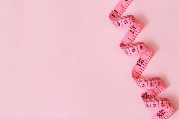 istock tape measure for obese people on a pink background soft focus 2105580332