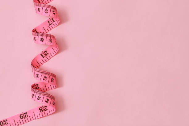 istock tape measure for obese people on a pink background soft focus 2105581368
