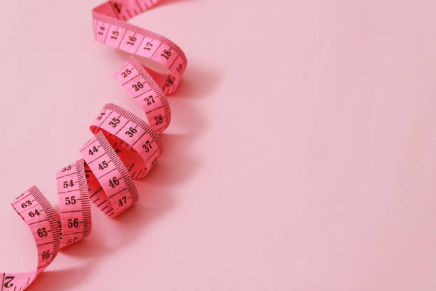 istock tape measure for obese people on a pink background soft focus 2105581371