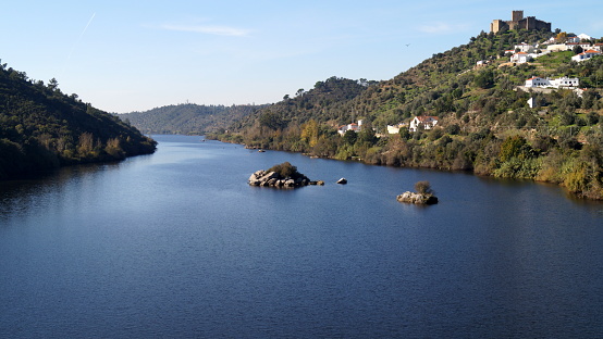 Tagus River, with the hilltop medieval Castle of Belver, on the right bank, overlooking the landscape, Belver, Portugal