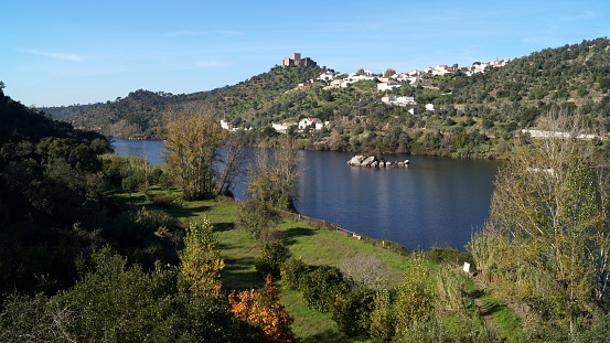 Tagus River, with the hilltop medieval Castle of Belver, on the right bank, overlooking the landscape, Belver, Portugal