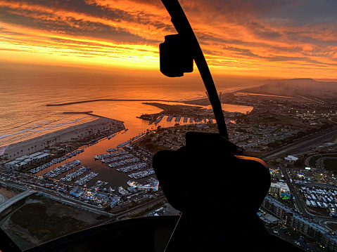 Sunset view from a helicopter along the California coastline.