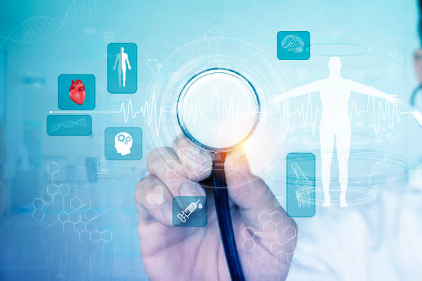 istock A doctor holding a stethoscope with a computer screen behind him showing a medical image. 2105634597