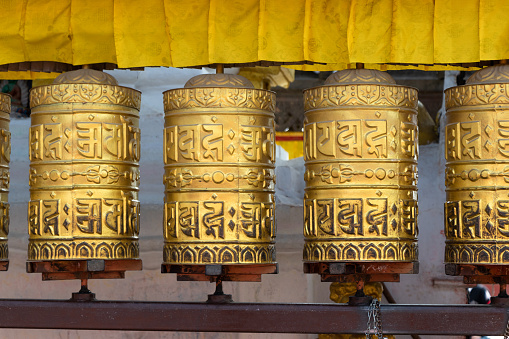 Prayer wheels is spun by devotees to aid for meditation and accumulating wisdom, good karma and putting negative energy aside