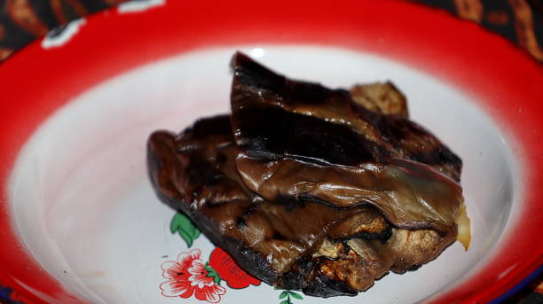 istock Grilled eggplant ready to be eaten on a plate 2105700479