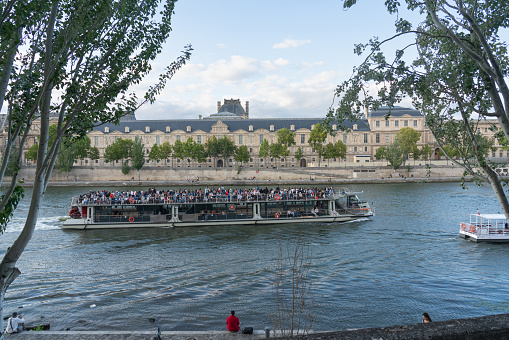 Boat sailing down the river in the afternoon in Paris. France. August 6, 2023.