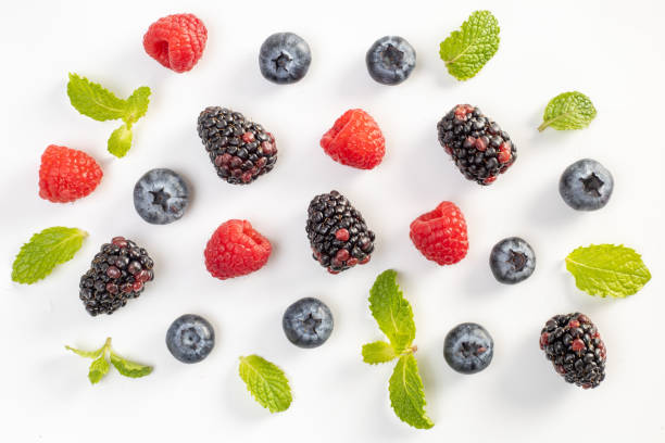 istock Blueberry, Mumberry, Raspberry and mint leaves on a white background. 2105747336