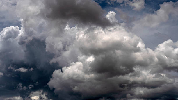 istock Dramatic dark storm rain clouds black sky background. Dark thunderstorm clouds rainny atmosphere. Meteorology danger windstorm disasters climate. Dark cloudscape storm disaster gloomy gray cloud sky 2105749880