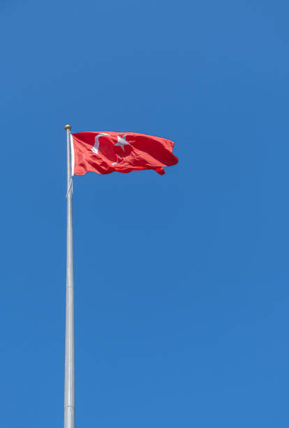 istock Turkish flag waving in the blue sky. flagpole. 2105822014