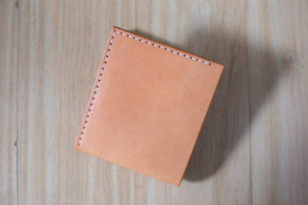 istock Genuine leather bifold money wallet with crafts tool 2105823036