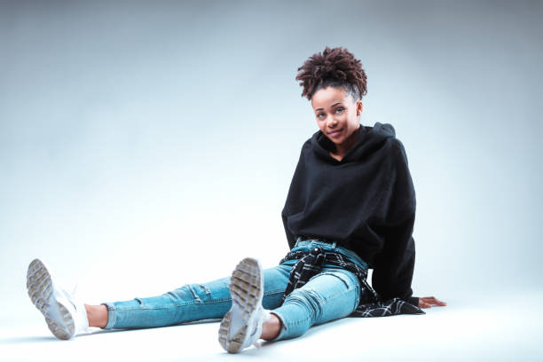 istock Grounded in denim, her smile subtly shines 2105834026