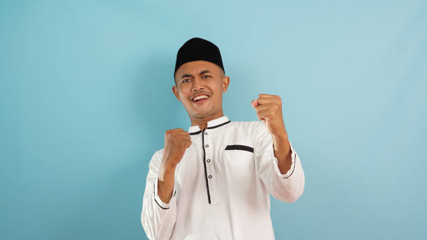 muslim man happy, excited and celebrating victory on ramadan