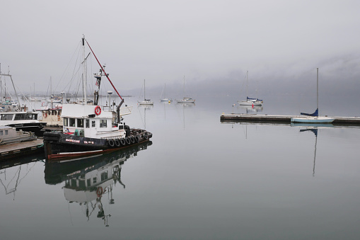 Boats docked at the Fishermen's Wharf during a winter season on Vancouver Island in Cowichan Bay, British Columbia, Canada.