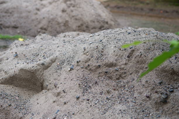 istock piles of sand used as building materials 2105882493