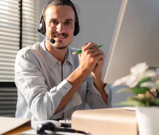 istock Customer service operator wear headset working at call center office help people in telemarketing helpline. 2105899416