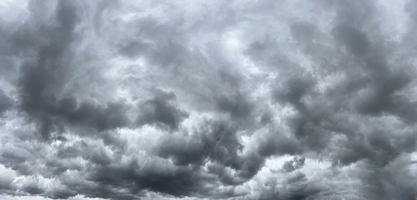 Panoramic cloudscape with dark grey toned storm cumulus clouds near Armidale, New England high country, NSW