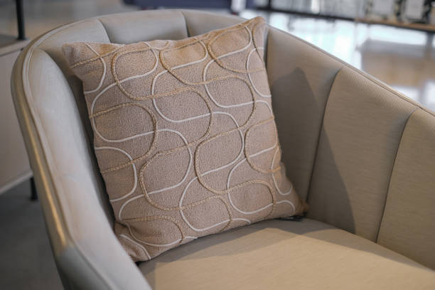 Close-up shot of modern elegant beige cushion on lounge chair
