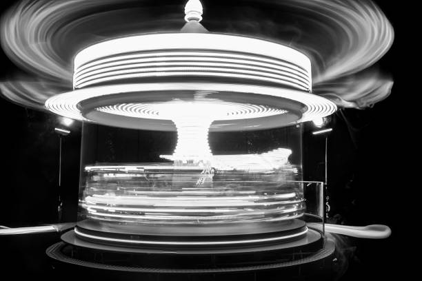 istock Children's carousel in a black and white long-term shot 2106008573