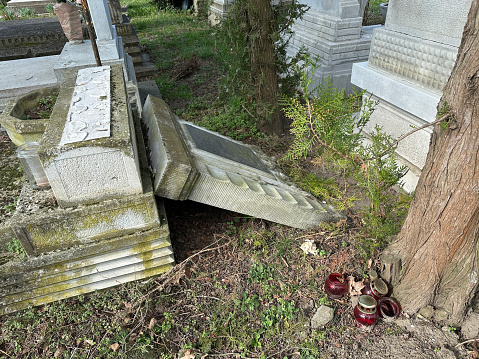 Broken tombstone in the public cemetery