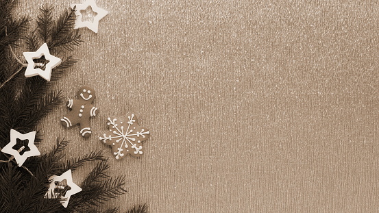 Vintage Christmas Composition With Gingerbread And Fir Branches. Sepia-Toned Background Gives A Classic Holiday Feel