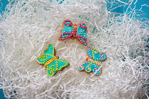 Decorative Butterfly Cookies On Shredded Paper