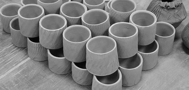 Collection Of Handcrafted Clay Cups In Monochrome