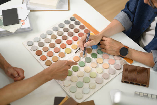 istock Interior designer or decorator helping customer choosing color palette for indoor decor 2106073225