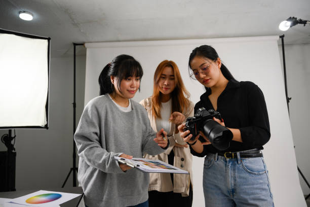 istock Beautiful creative female freelancer working at modern photography studio 2106074289