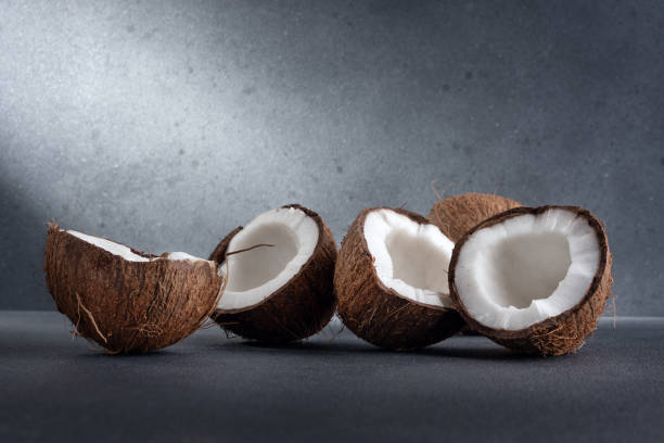 istock Cracked coconut fruit and whole coconut 2106074296
