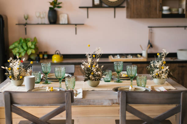 istock A beautiful festive dining table in the rustic style. Dried flowers in a ceramic vase on the table 2106081305