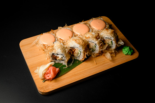 Delectable bonito rolls featuring tuna flakes and a delightful touch of pink cream, creating a delicious and visually appealing combination.
