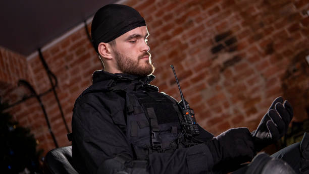 During a high-stakes scenario, an agent effectively utilizes his field equipment to navigate through the intense operation