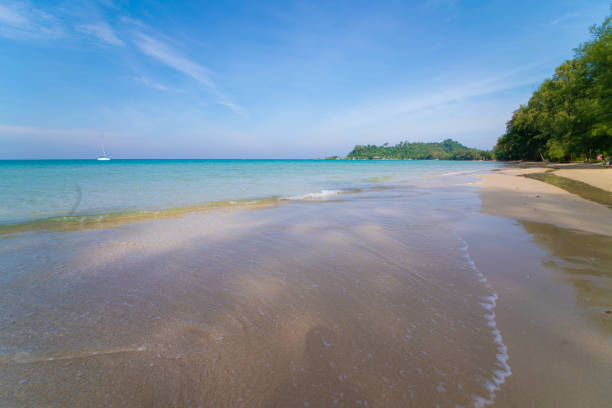 istock Sea beach wave clear turquoise sea water smooth sand blue sky with cloud 2106143695