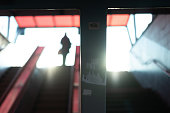 Underpass, Escalator, Reflected Light, Defocused People