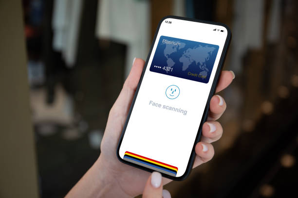 istock woman hand hold phone with face scanning id on screen 2106204447