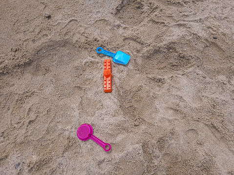 children's toys on beach sand. selective focus