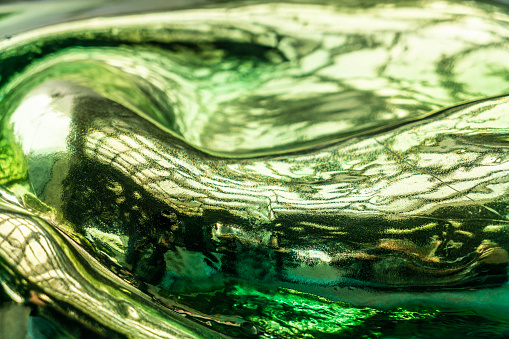 This image shows a macro abstract art texture view of a beautiful vintage lead crystal glass vase with diamond cut facets.