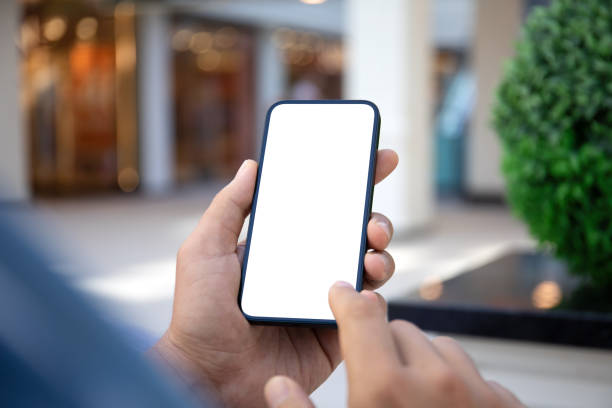 istock man hand hold phone with isolated screen on the street 2106270177